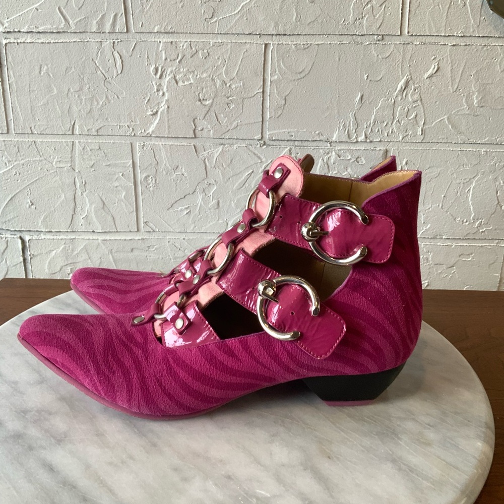 Pink suede John Fluevog boots with silver buckles